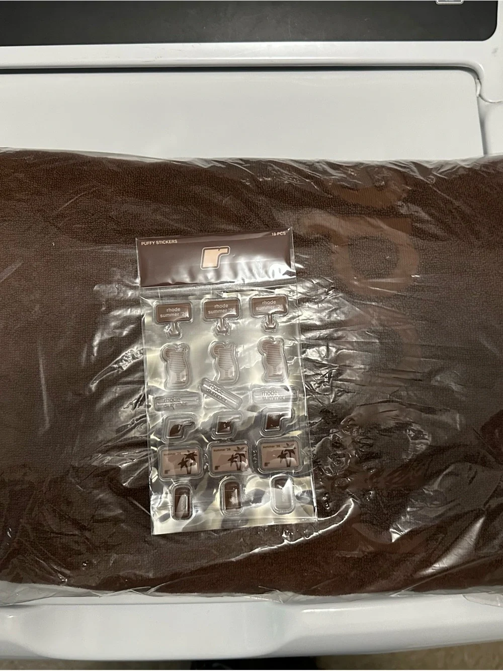 RHODE Rich Brown Beach Towel with stickers